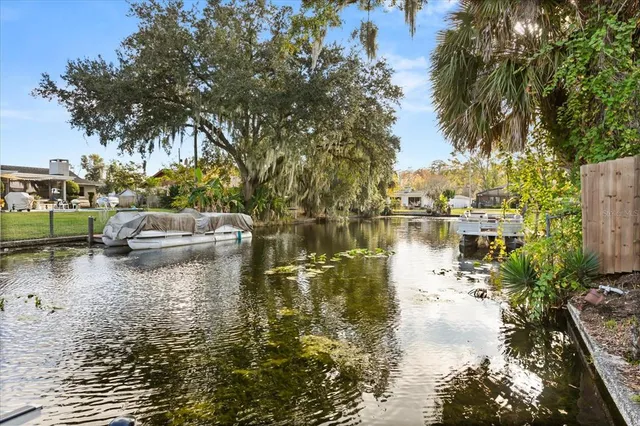 a swimming pool view with a lake view