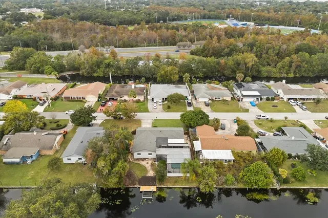 an aerial view of residential houses with outdoor space