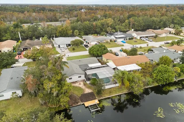 an aerial view of a house with a lake view