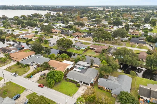 an aerial view of residential building with parking