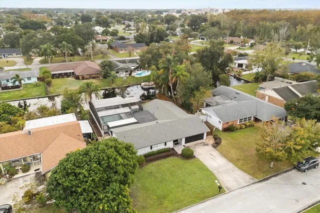 an aerial view of multiple houses with yard