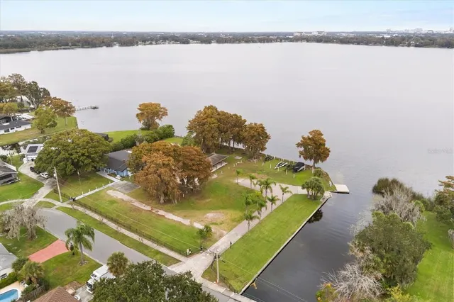a bed sitting in a bedroom next to a blue wall