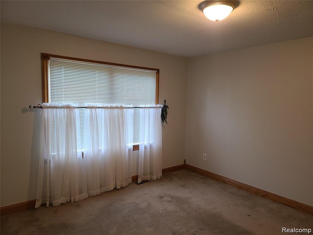 3082 West Coon Lake Road Howell, MI 48843 - Photo 22 of 32 bed 2 down.jpg