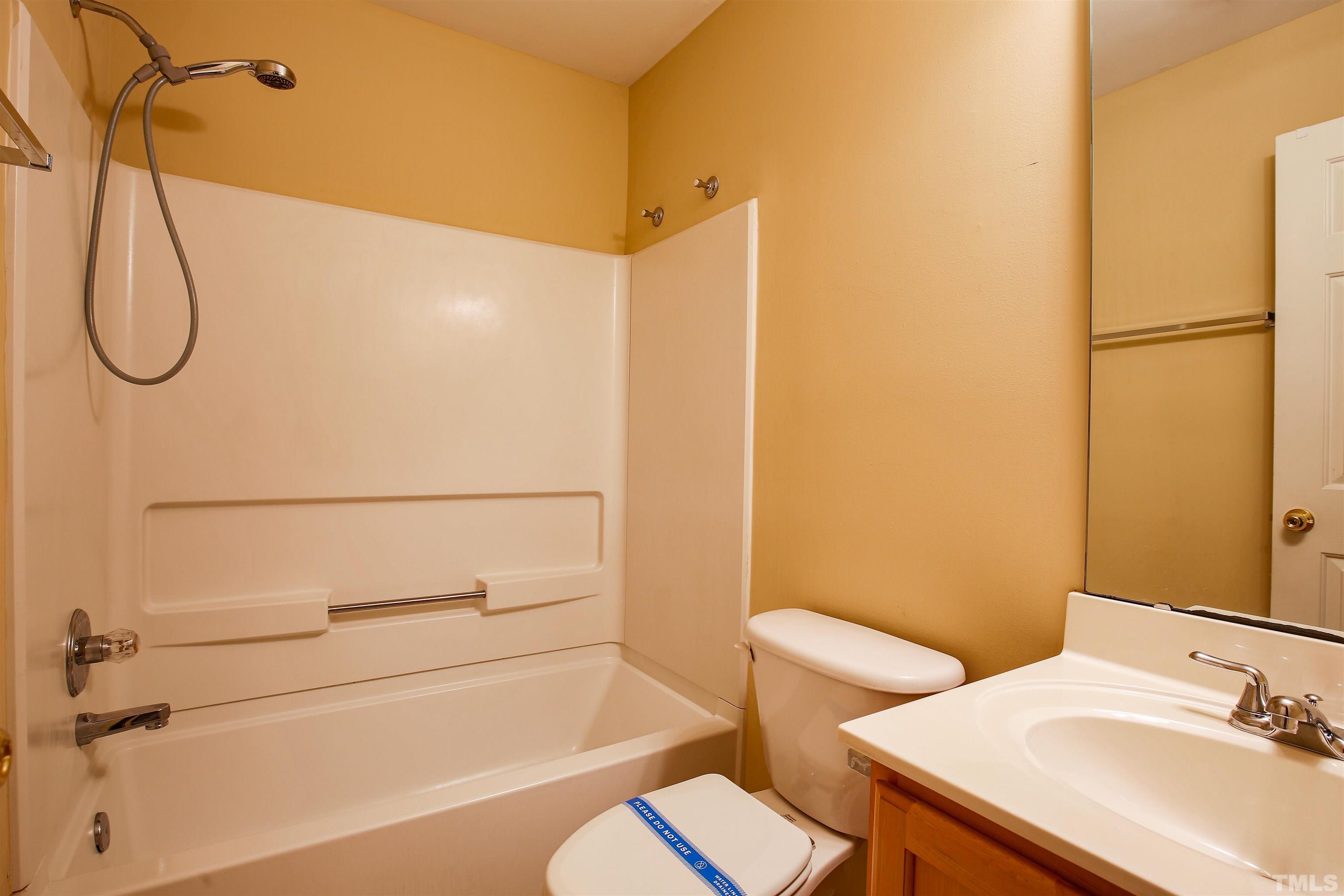 2208 Spruce Shadows Lane Raleigh, NC 27614 - Photo 15 of 26 a bathroom with a granite countertop sink toilet and shower