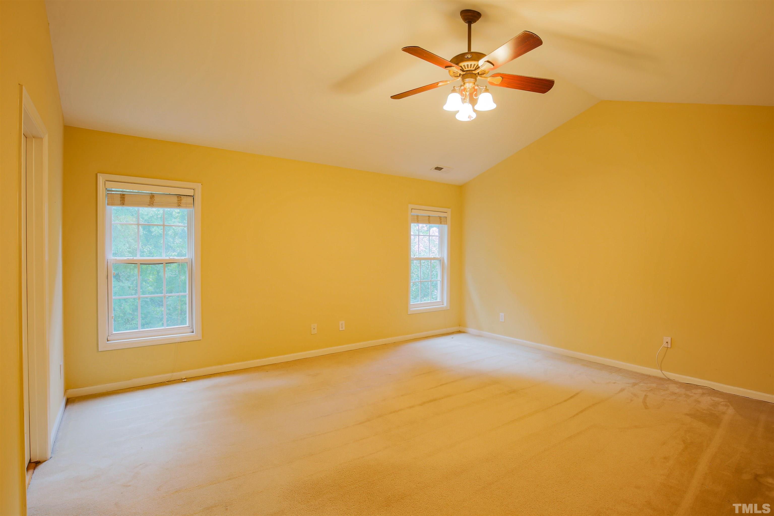 2208 Spruce Shadows Lane Raleigh, NC 27614 - Photo 18 of 26 a view of an empty room with a window