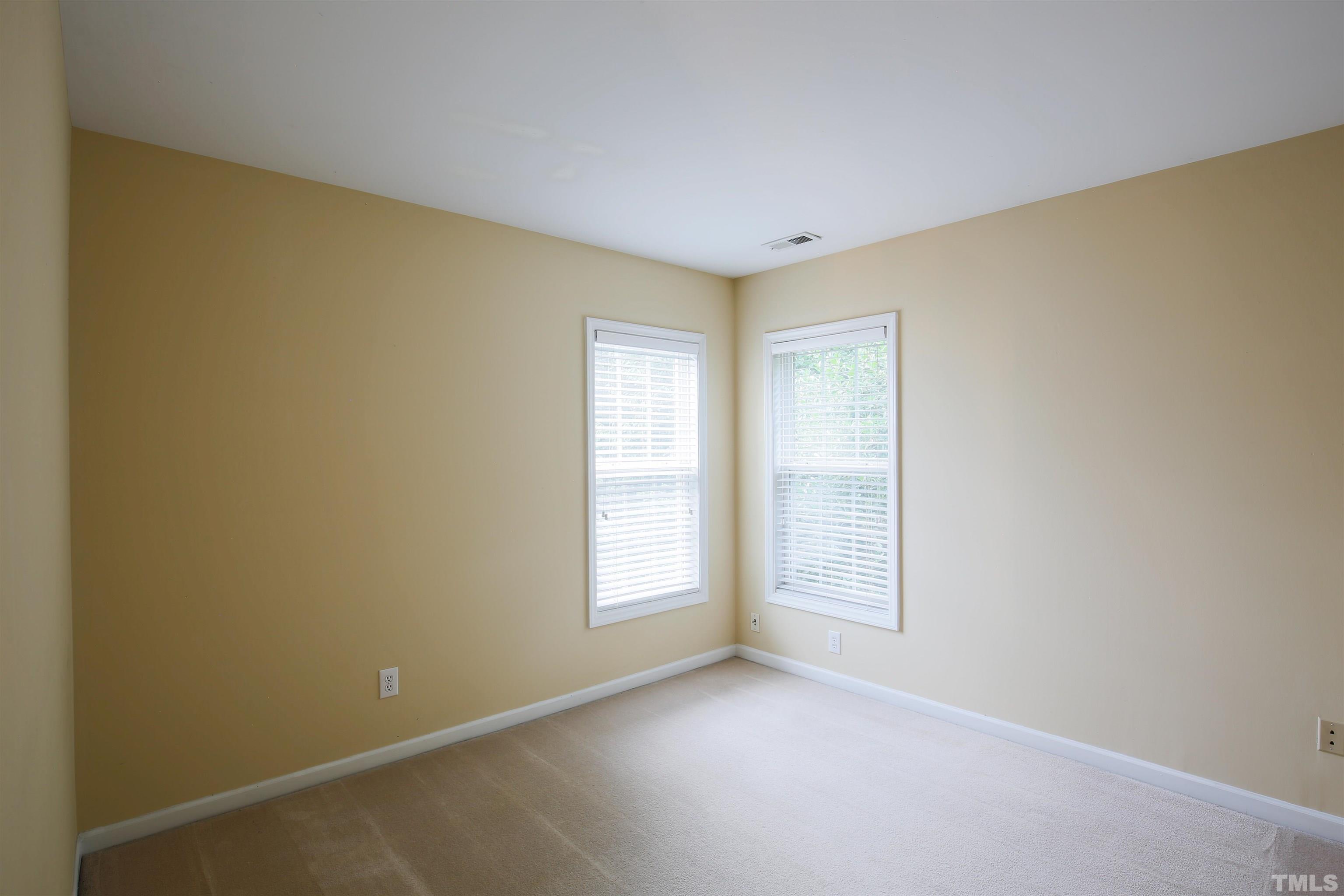2208 Spruce Shadows Lane Raleigh, NC 27614 - Photo 21 of 26 a view of an empty room with a window