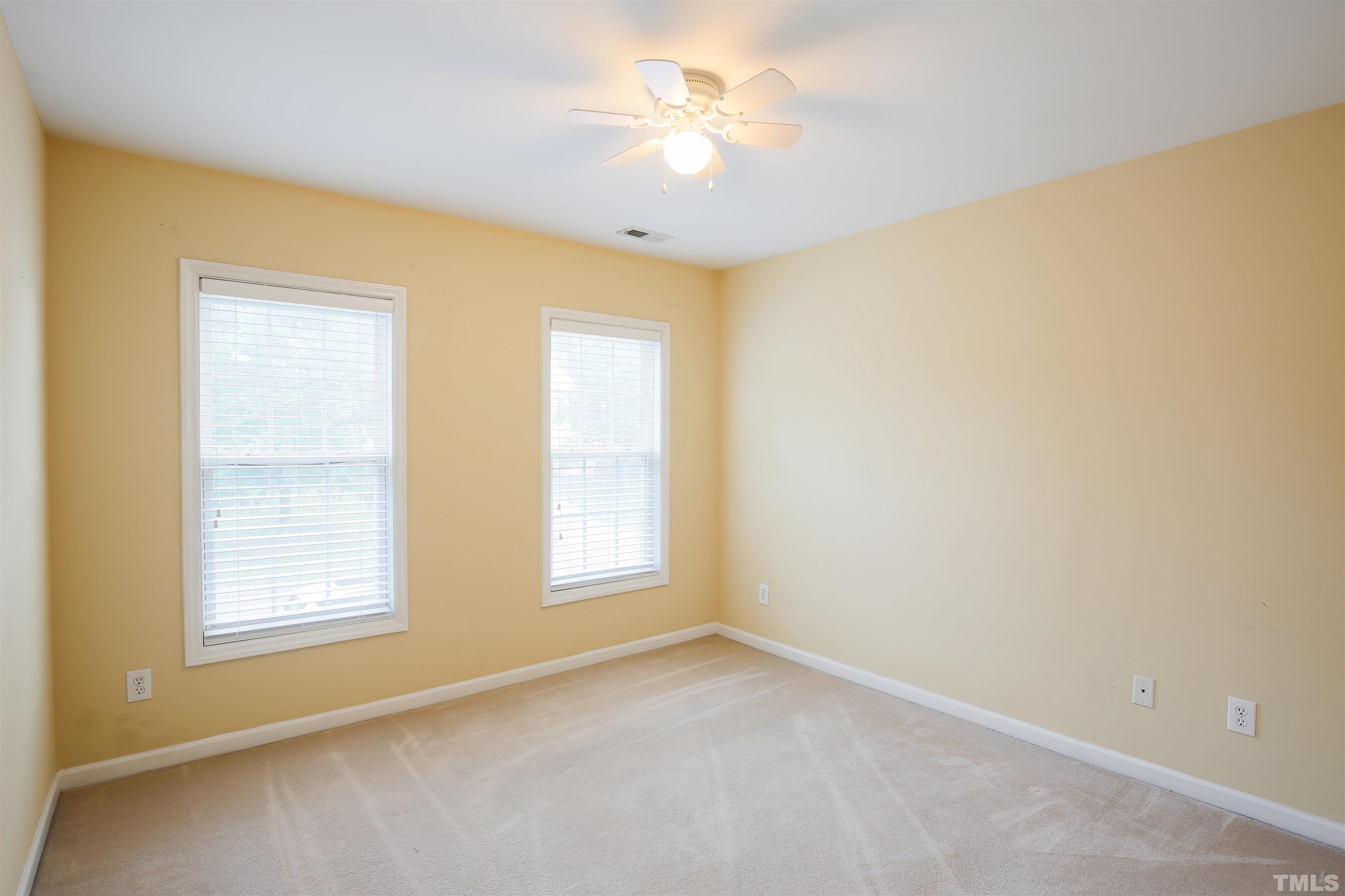 2208 Spruce Shadows Lane Raleigh, NC 27614 - Photo 22 of 26 a view of an empty room with a window