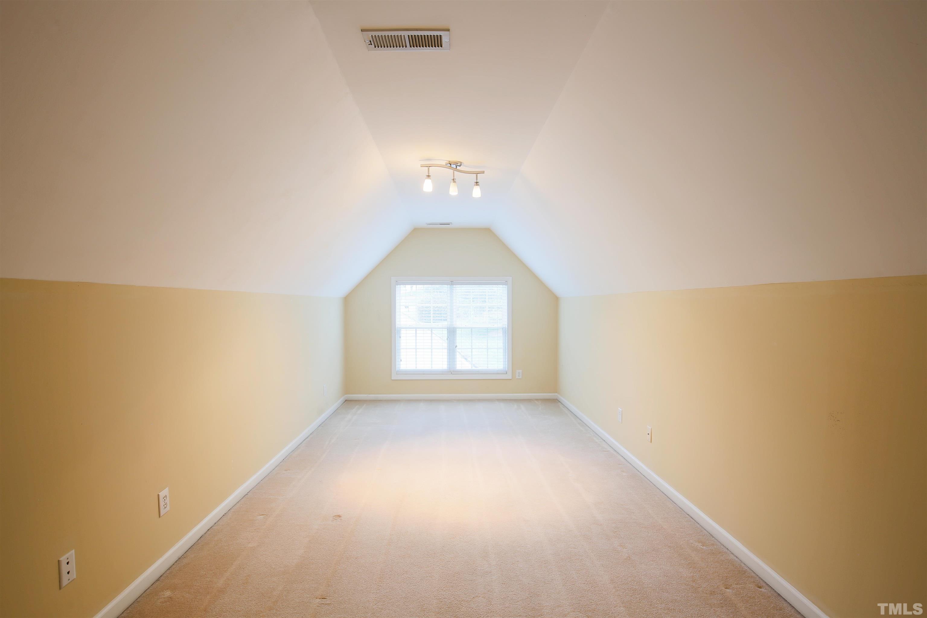 2208 Spruce Shadows Lane Raleigh, NC 27614 - Photo 25 of 26 an empty room with a window