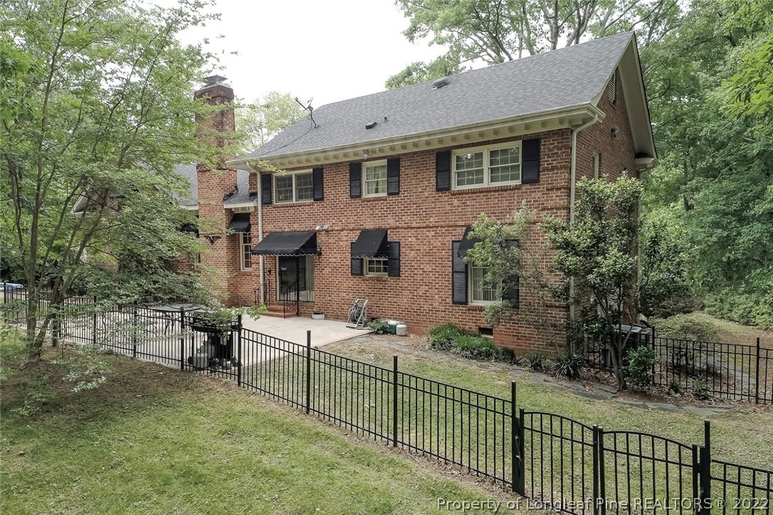 503 Queensferry Road Cary, NC 27511 - Photo 18 of 49 a view of a house with a small yard and wooden fence