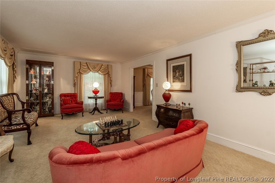 503 Queensferry Road Cary, NC 27511 - Photo 24 of 49 a living room with furniture and a wooden floor