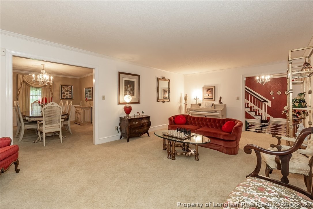 503 Queensferry Road Cary, NC 27511 - Photo 25 of 49 a bedroom with furniture and a lamp