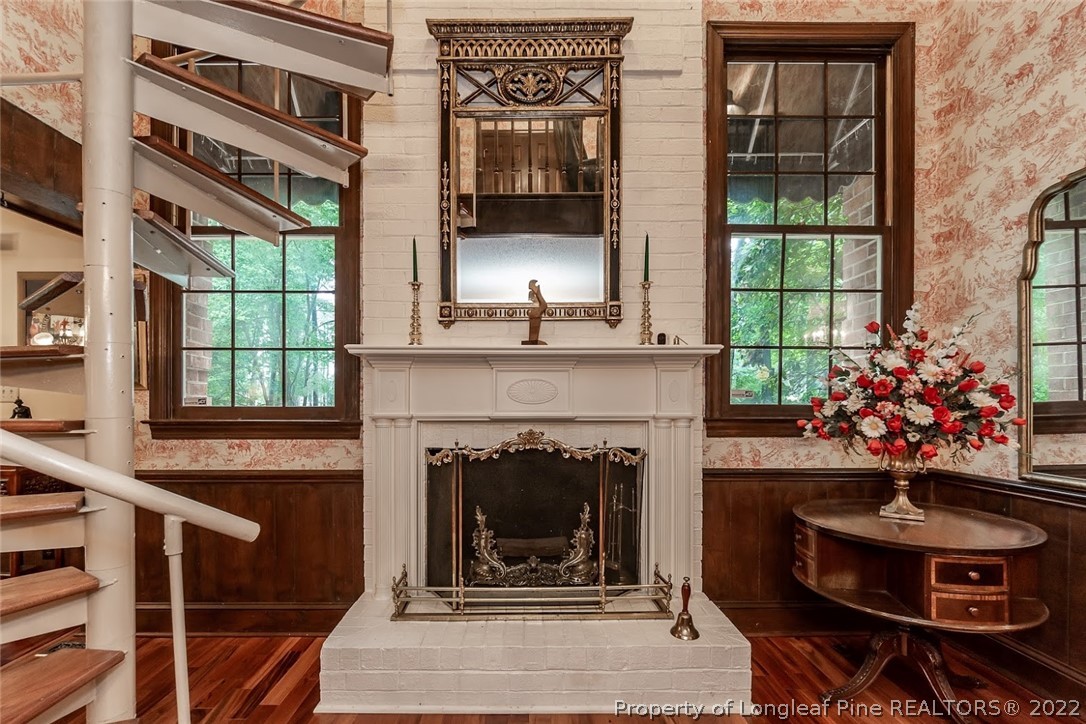 503 Queensferry Road Cary, NC 27511 - Photo 35 of 49 a living room with a fireplace and windows