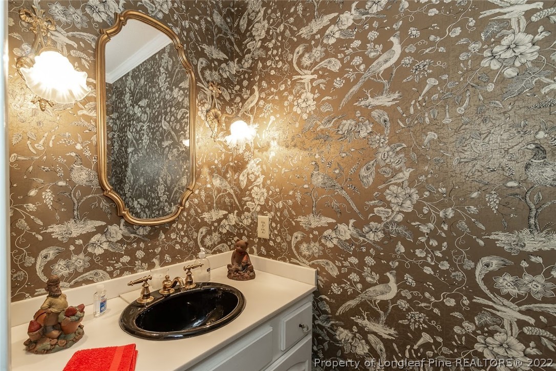 503 Queensferry Road Cary, NC 27511 - Photo 37 of 49 a bathroom with a sink and mirror