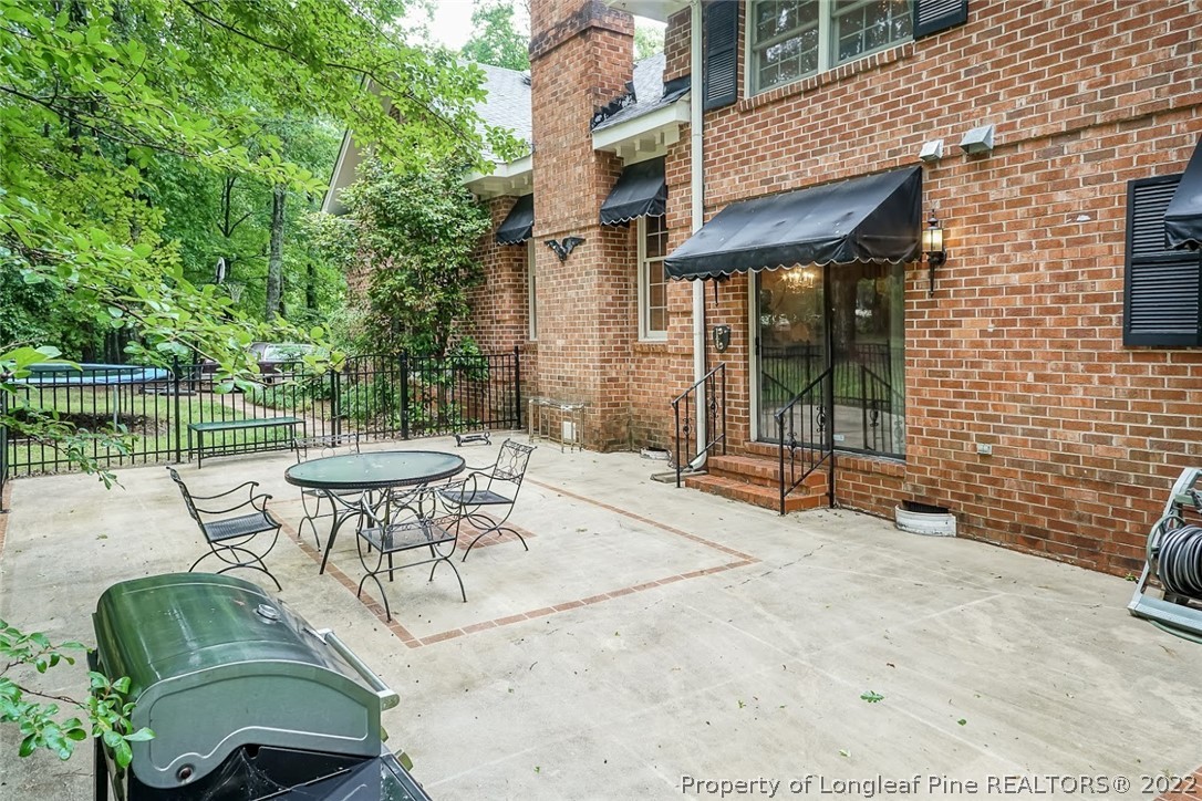 503 Queensferry Road Cary, NC 27511 - Photo 4 of 49 a view of backyard with outdoor seating and green space