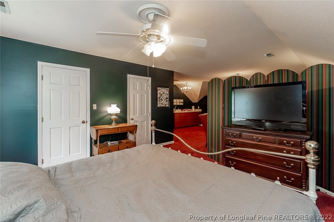 503 Queensferry Road Cary, NC 27511 - Photo 41 of 49 a living room with furniture and a flat screen tv
