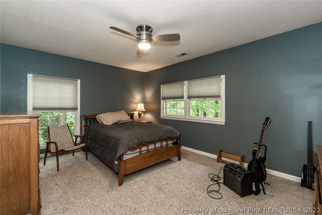 503 Queensferry Road Cary, NC 27511 - Photo 47 of 49 a bedroom with a bed and window