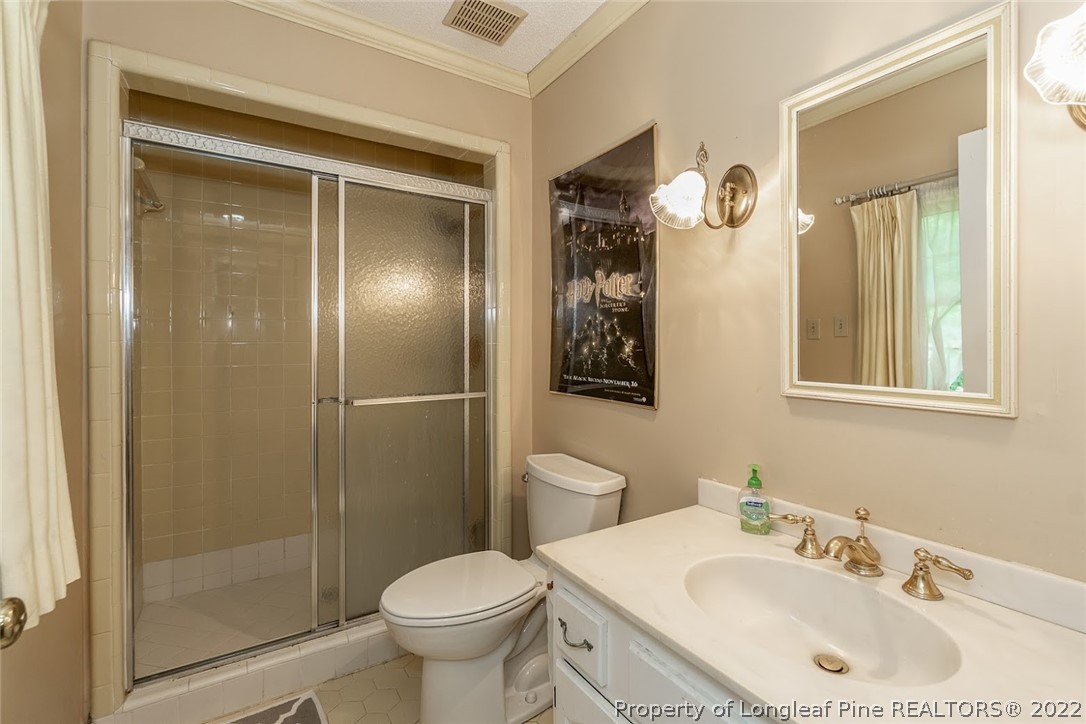 503 Queensferry Road Cary, NC 27511 - Photo 48 of 49 a bathroom with a sink toilet and shower