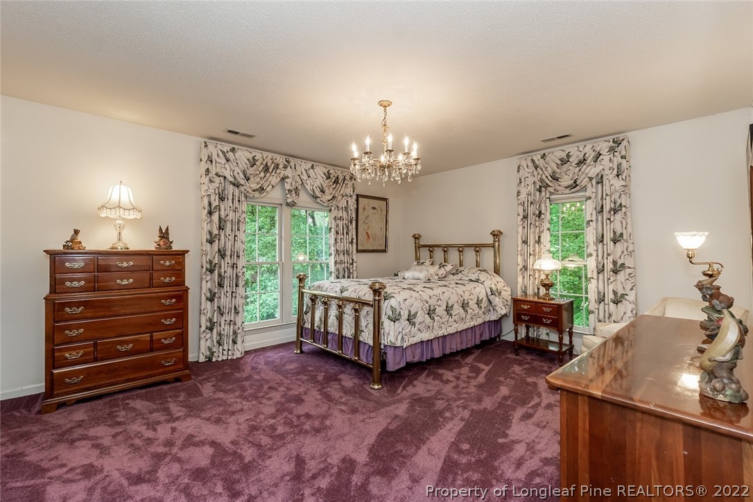 503 Queensferry Road Cary, NC 27511 - Photo 49 of 49 a bed room with a bed and a dresser