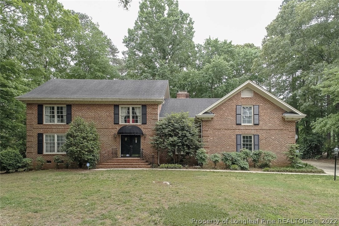 503 Queensferry Road Cary, NC 27511 - Photo 9 of 49 a front view of a house with a yard and garage
