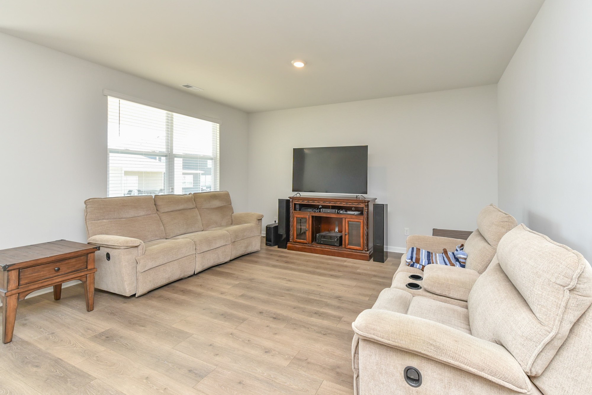 630 Pine Bloom Road Lebanon, TN 37087 - Photo 16 of 44 a living room with furniture a fireplace and a flat screen tv
