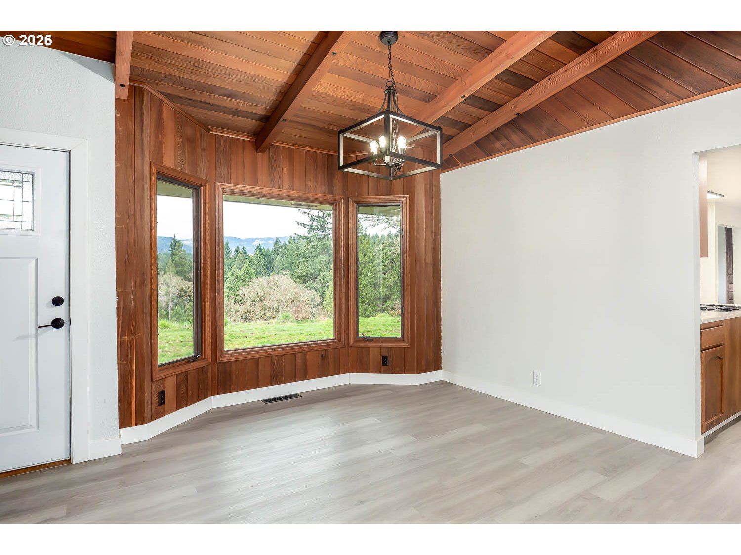48187 McFarland Road Oakridge, OR 97463 - Photo 18 of 41 a view of an empty room with wooden floor and a window
