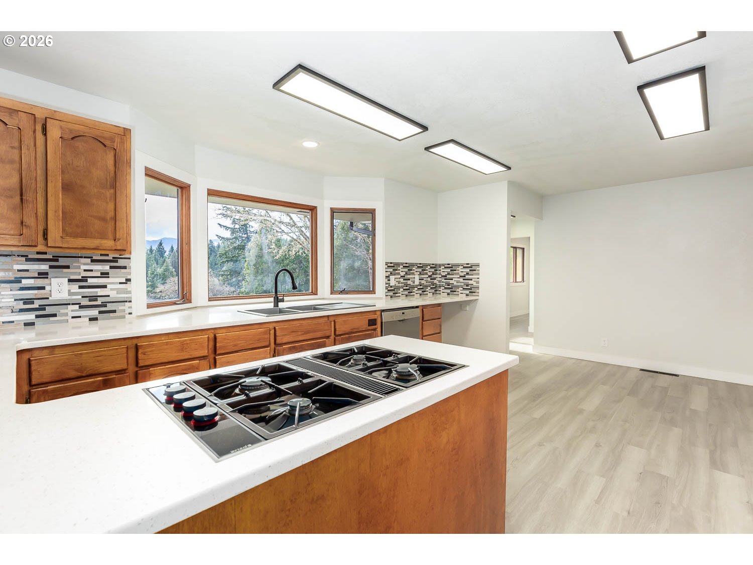 48187 McFarland Road Oakridge, OR 97463 - Photo 19 of 41 a kitchen with a stove a sink and a refrigerator