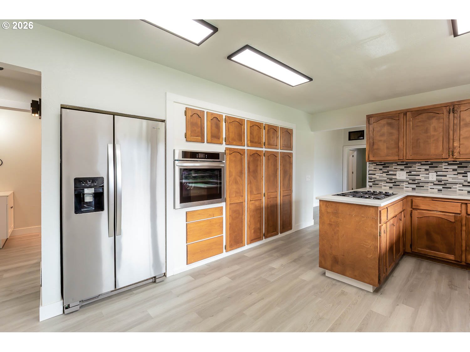 48187 McFarland Road Oakridge, OR 97463 - Photo 21 of 41 a kitchen with stainless steel appliances a refrigerator and a stove top oven