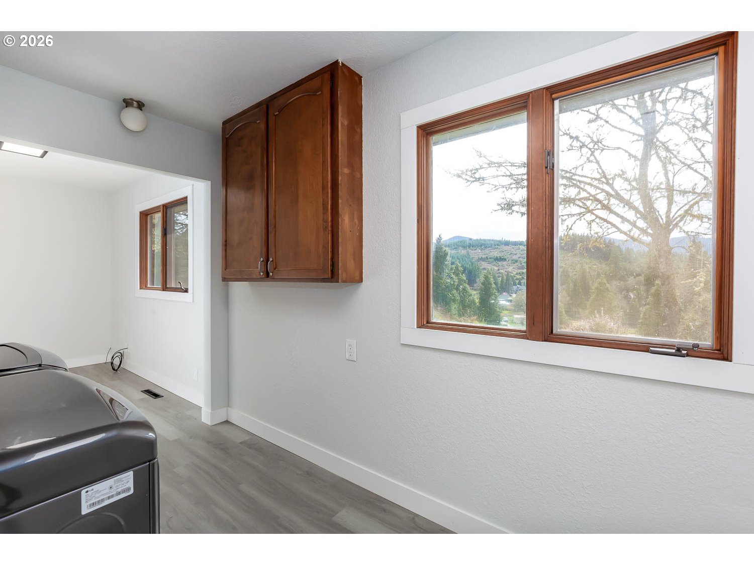 48187 McFarland Road Oakridge, OR 97463 - Photo 25 of 41 a room with a window and wooden floor