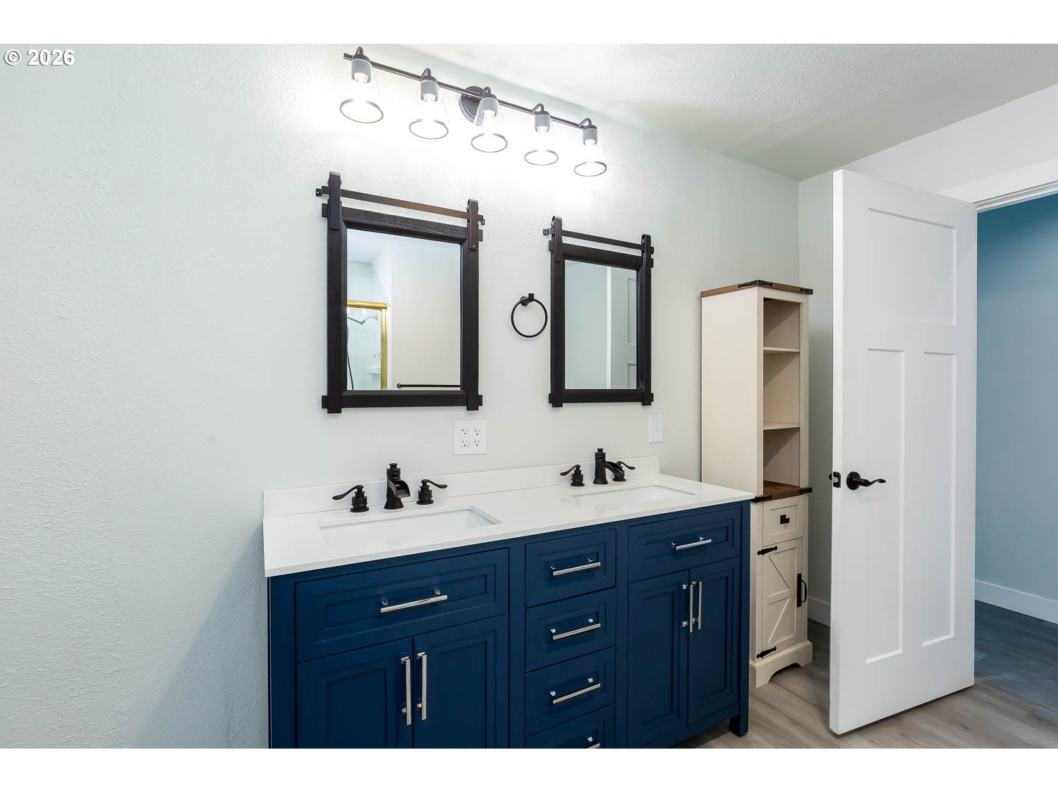 48187 McFarland Road Oakridge, OR 97463 - Photo 32 of 41 a bathroom with a double vanity sink and mirror