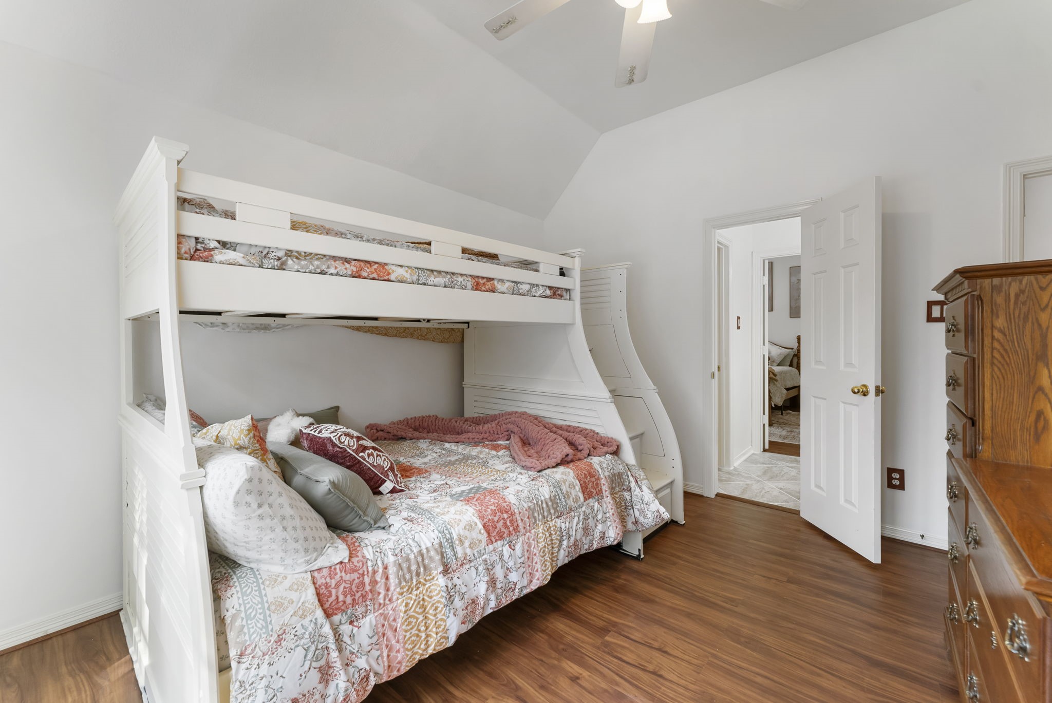12907 Ryaneagles Circle Houston, TX 77044 - Photo 39 of 48 a bedroom with bed and a wooden floor