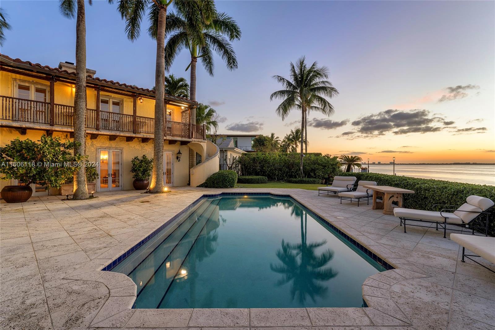 4810 North Bay Road Miami Beach, FL 33140 - Photo 1 of 61 a view of swimming pool with outdoor seating and city view