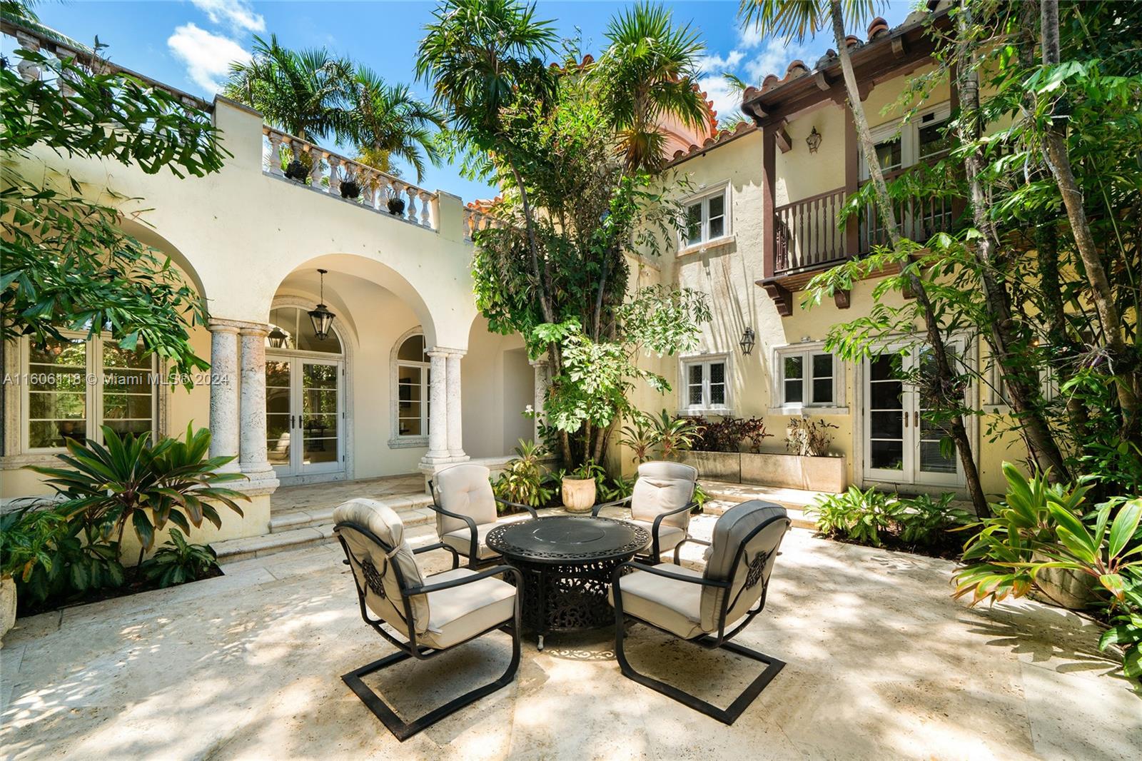 4810 North Bay Road Miami Beach, FL 33140 - Photo 17 of 61 a view of a house with backyard and sitting area