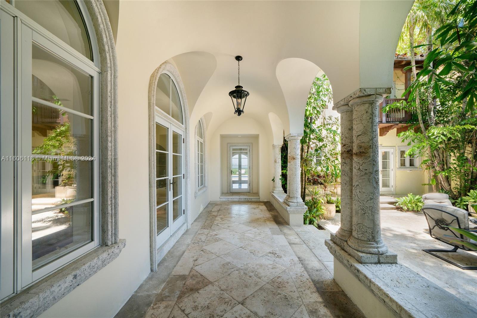 4810 North Bay Road Miami Beach, FL 33140 - Photo 18 of 61 a front view of a house with a porch