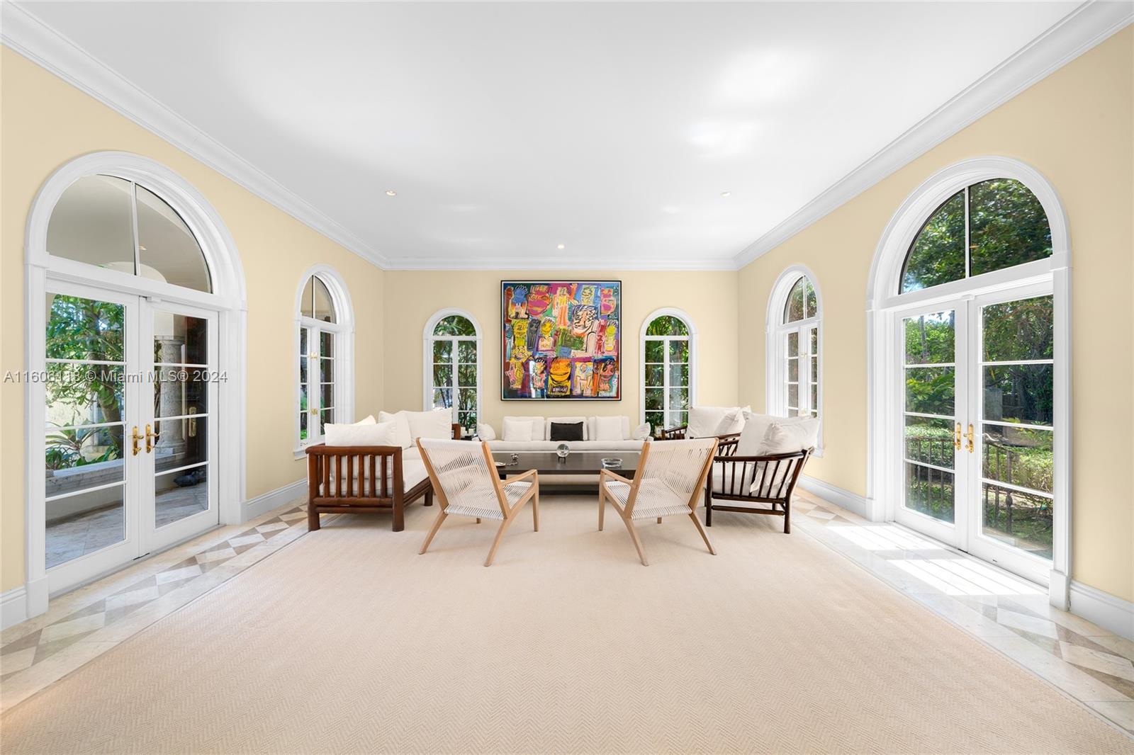 4810 North Bay Road Miami Beach, FL 33140 - Photo 19 of 61 a living room with furniture and a large window