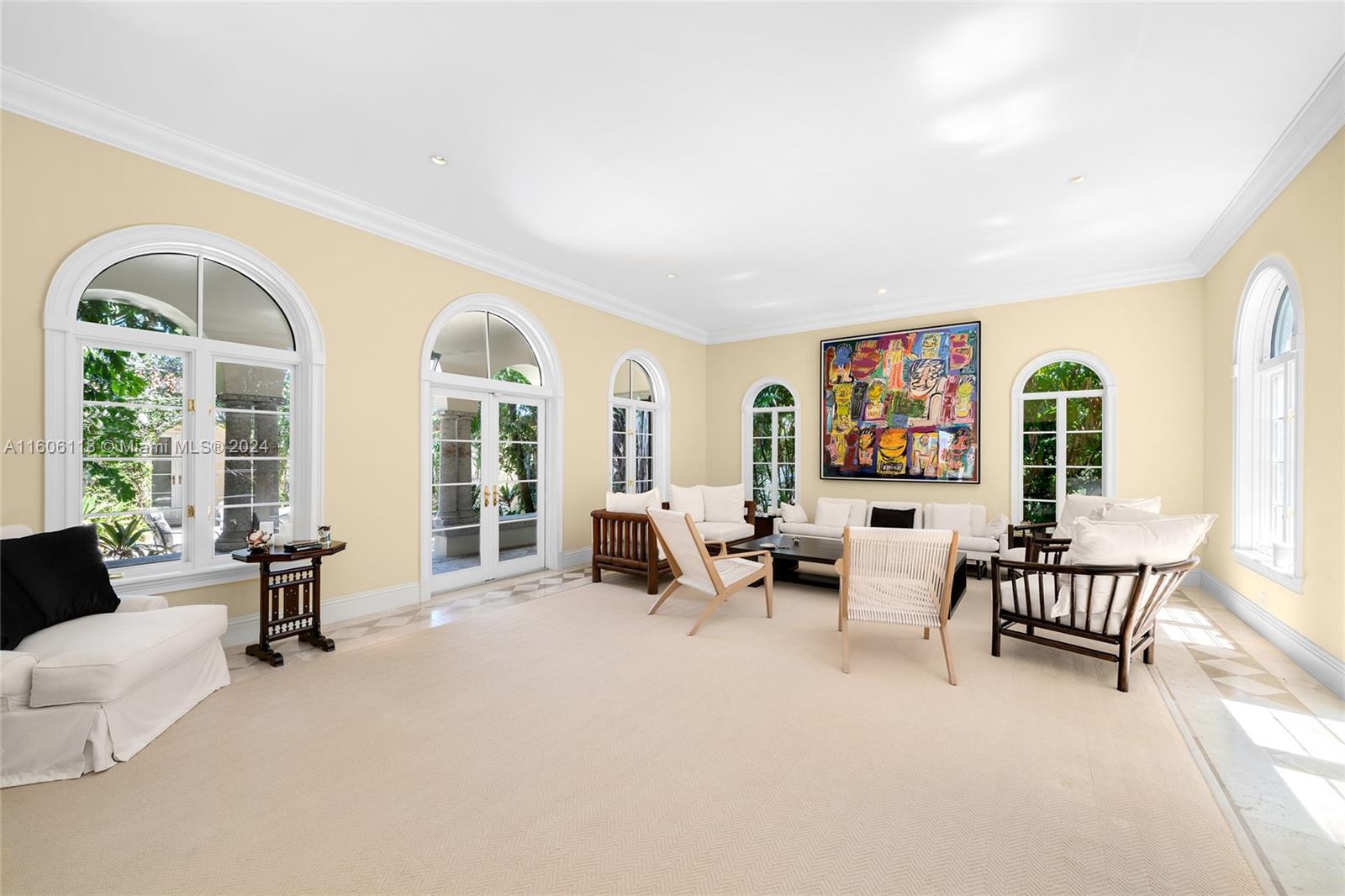 4810 North Bay Road Miami Beach, FL 33140 - Photo 20 of 61 a living room with furniture and a large window