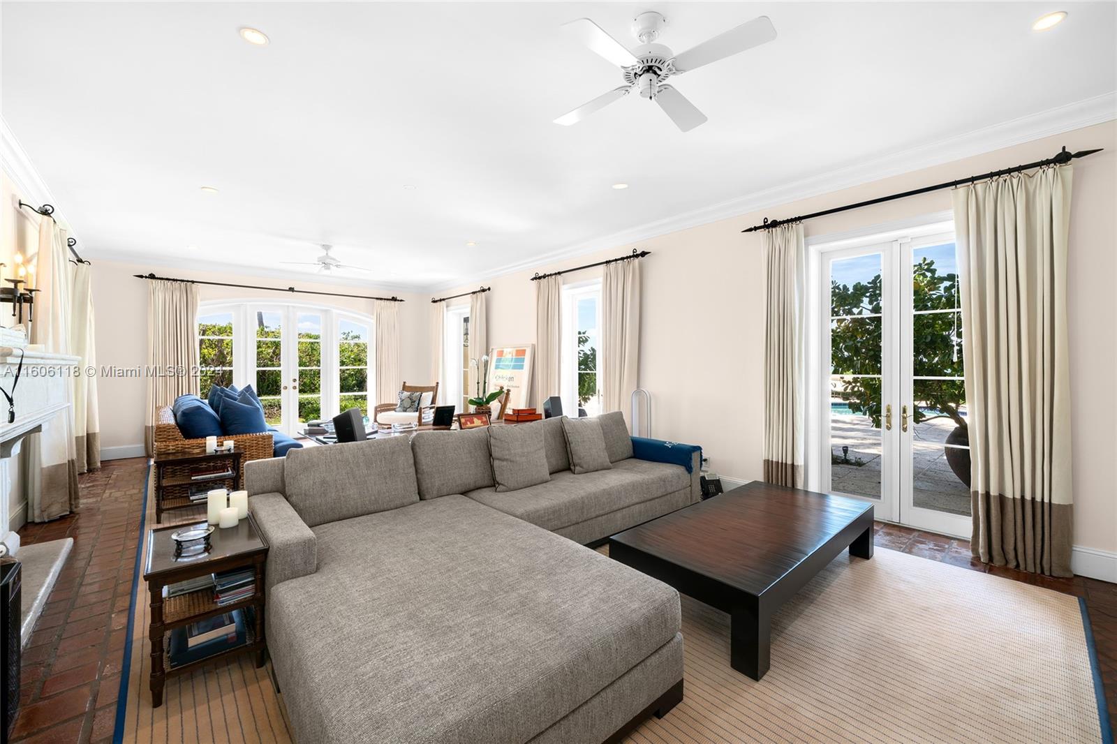 4810 North Bay Road Miami Beach, FL 33140 - Photo 23 of 61 a living room with furniture and a large window