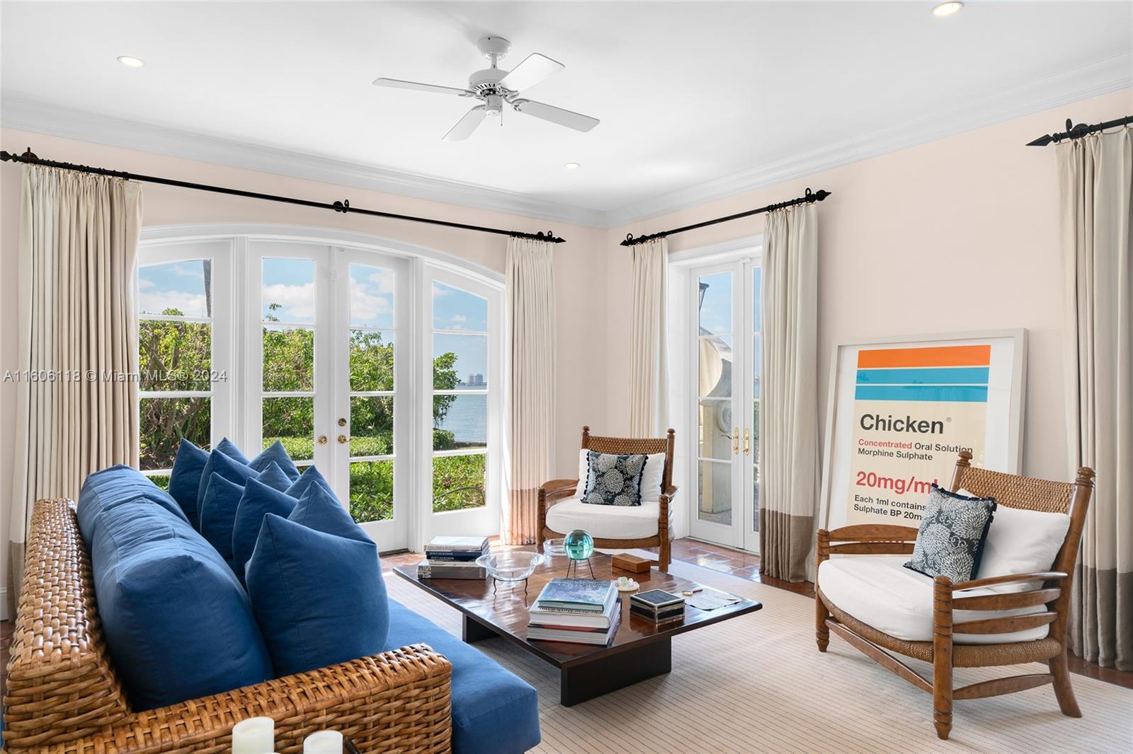 4810 North Bay Road Miami Beach, FL 33140 - Photo 24 of 61 a living room with furniture and a large window