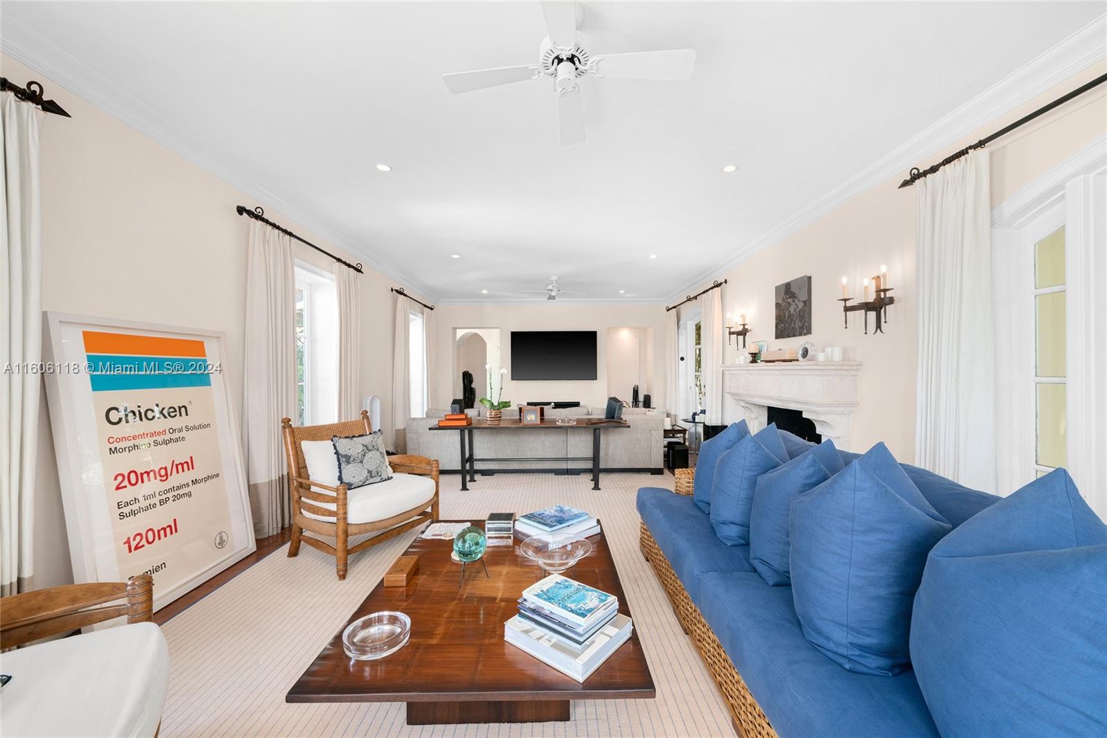 4810 North Bay Road Miami Beach, FL 33140 - Photo 25 of 61 a living room with furniture and a flat screen tv