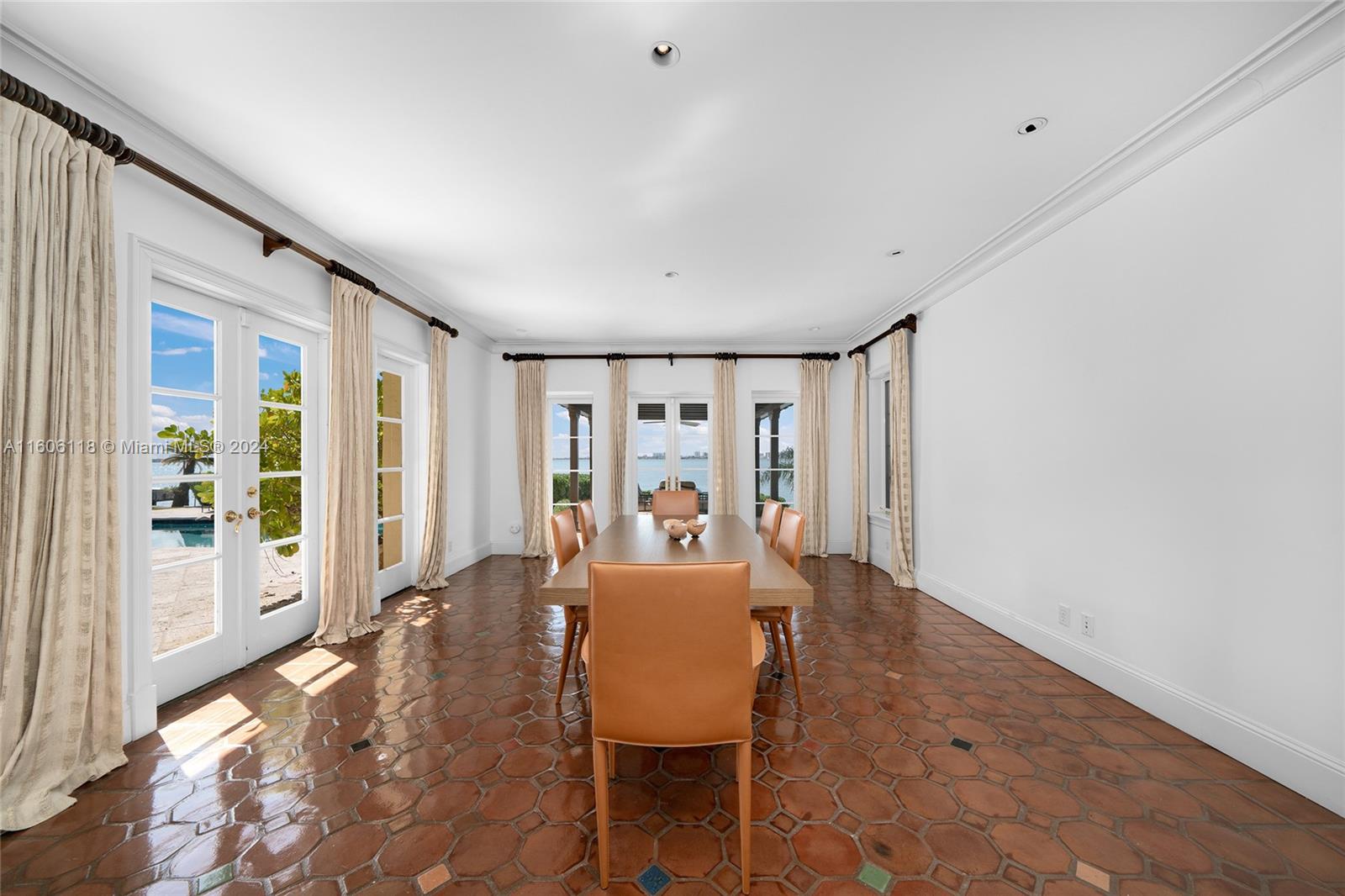 4810 North Bay Road Miami Beach, FL 33140 - Photo 27 of 61 a living room with furniture and large windows
