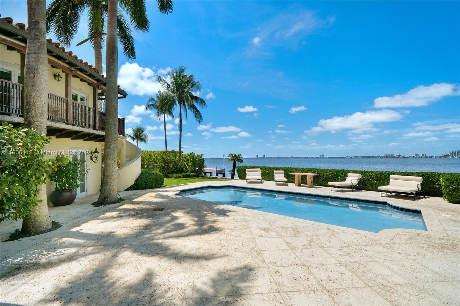 4810 North Bay Road Miami Beach, FL 33140 - Photo 32 of 61 a view of swimming pool with outdoor seating and plants