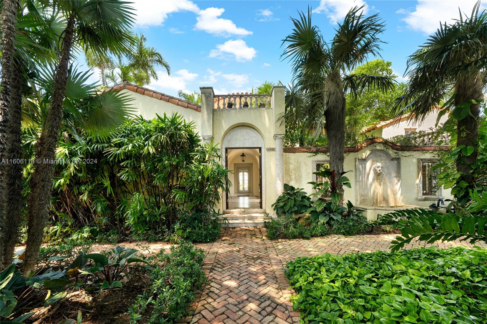 4810 North Bay Road Miami Beach, FL 33140 - Photo 45 of 61 a front view of a house with a garden