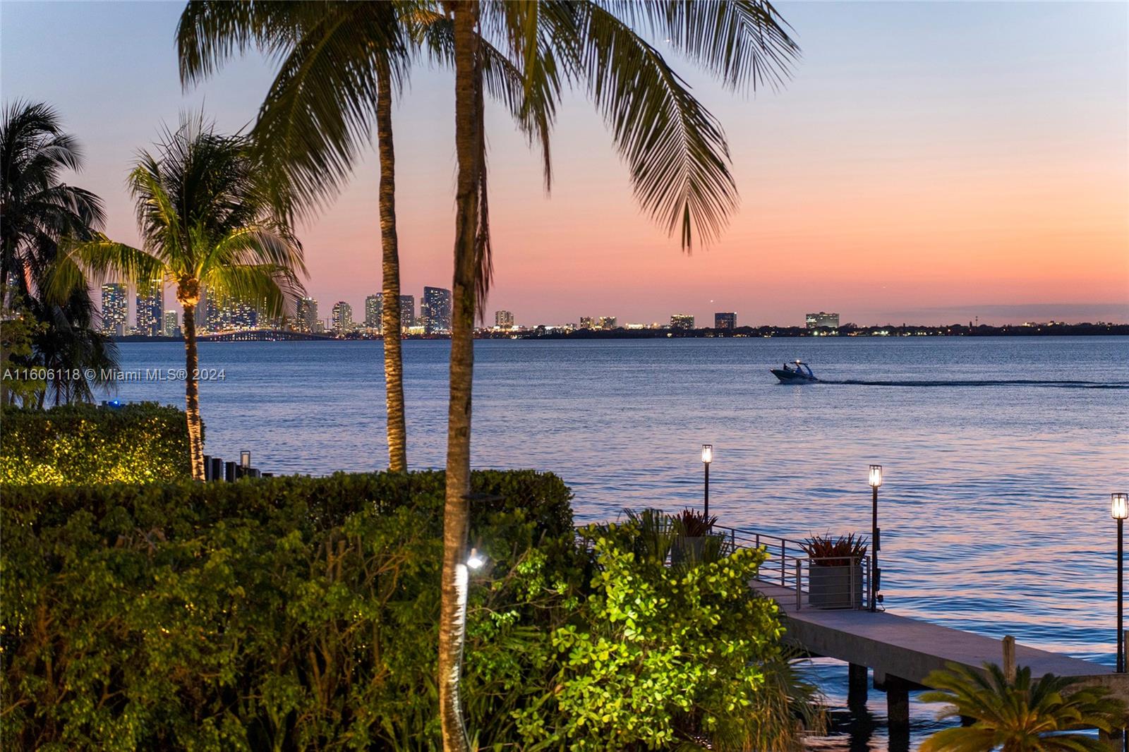 4810 North Bay Road Miami Beach, FL 33140 - Photo 49 of 61 a view of a terrace with outdoor seating space and lake view