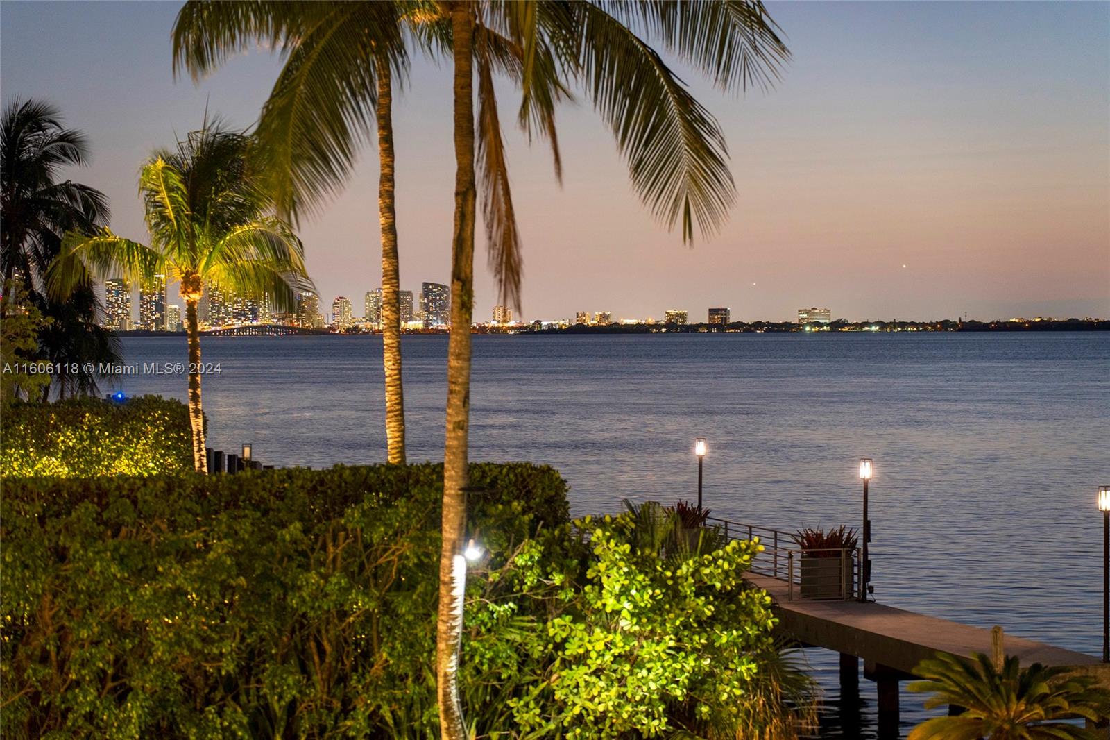 4810 North Bay Road Miami Beach, FL 33140 - Photo 50 of 61 a view of a yard with a table and chair in the background