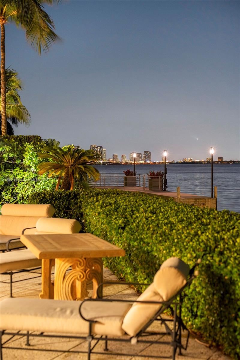 4810 North Bay Road Miami Beach, FL 33140 - Photo 59 of 61 a view of a chairs and table on the patio