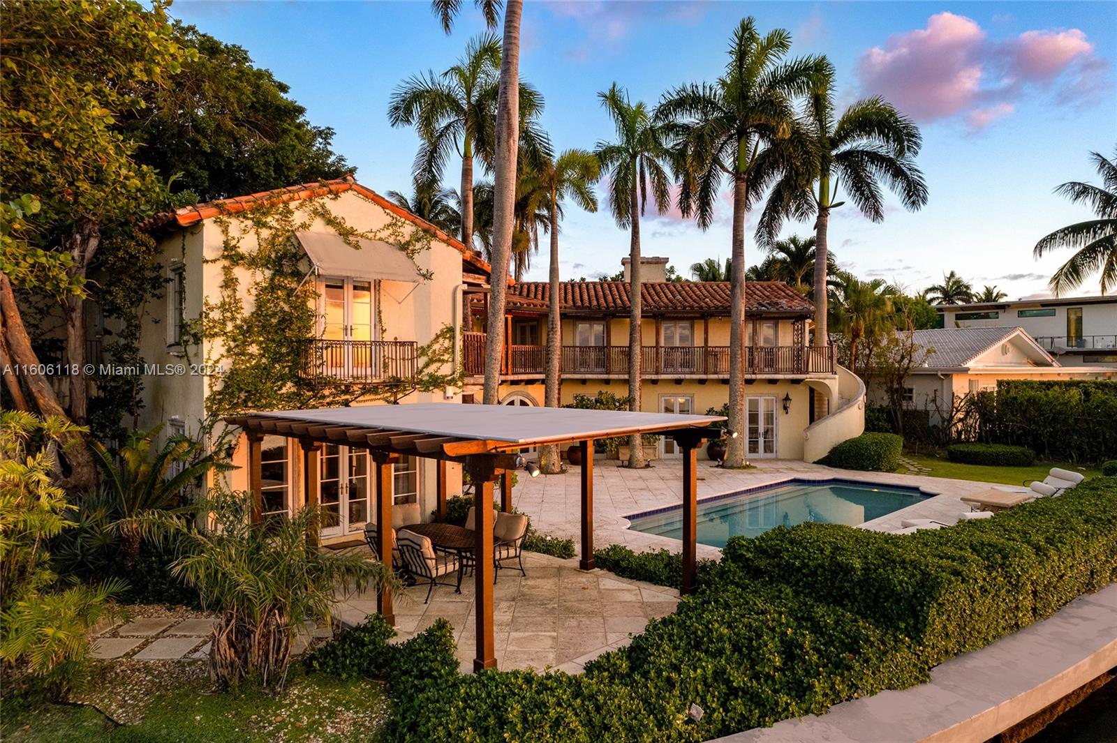 4810 North Bay Road Miami Beach, FL 33140 - Photo 9 of 61 a view of a swimming pool with a patio