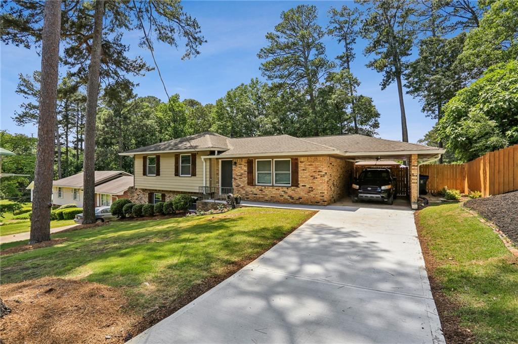 2740 Frontier Trail Atlanta, GA 30341 - Photo 3 of 29 a front view of a house with a yard and trees