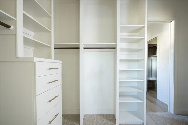 a view of an empty walk in closet