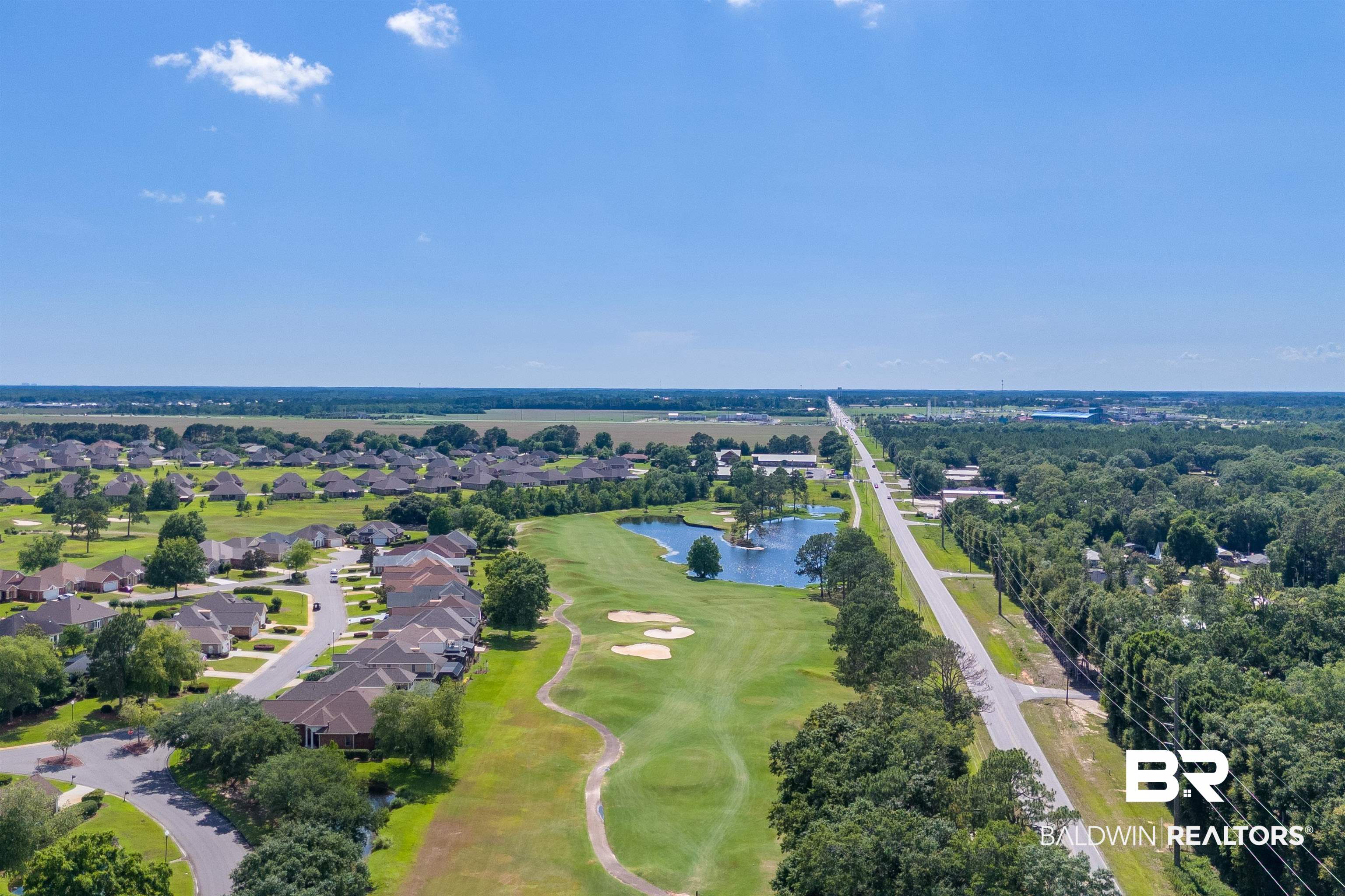 22739 Inverness Way Foley, AL 36535 - Photo 65 of 80 Aerial view of residential area with a nearby body of water and a golf club