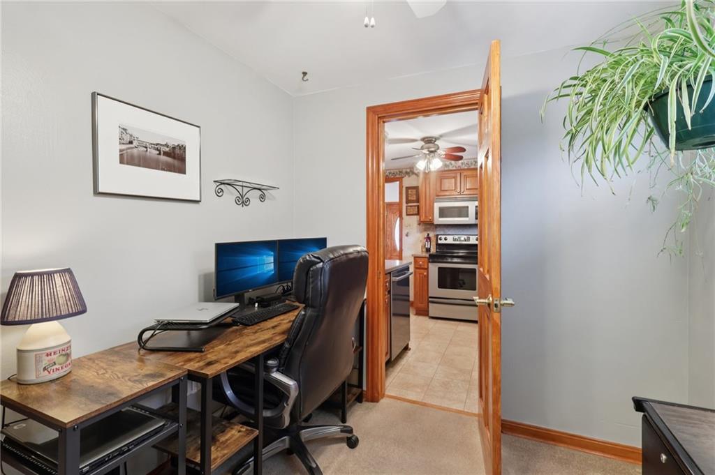 158 Maple Street Rochester, PA 15074 - Photo 16 of 37 a workspace with furniture and wooden floor