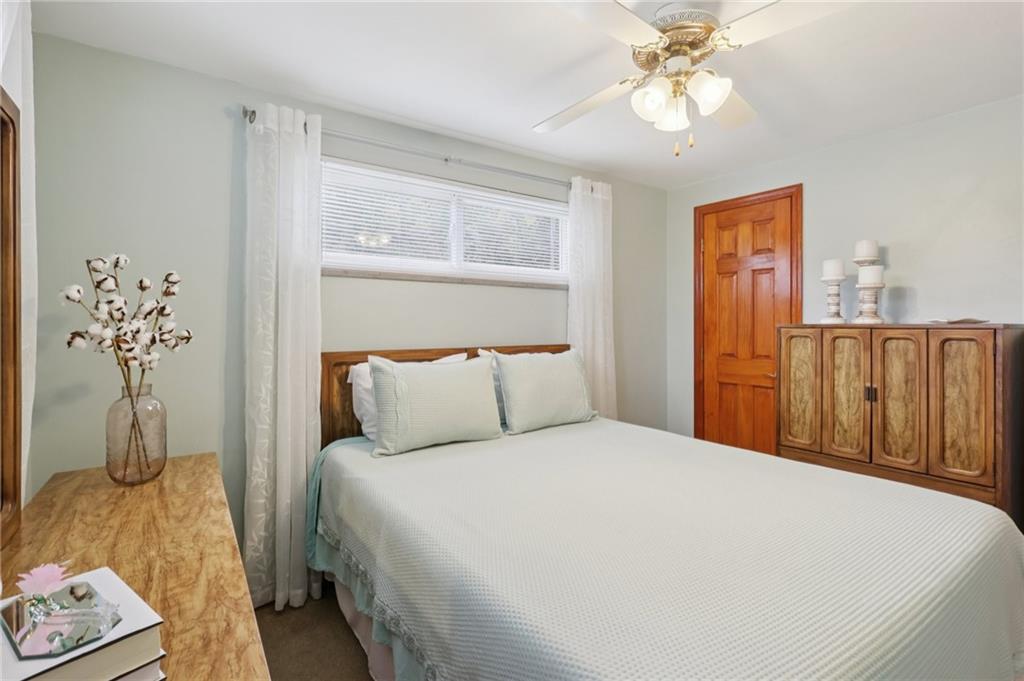 158 Maple Street Rochester, PA 15074 - Photo 20 of 37 a bedroom with a bed and a chandelier